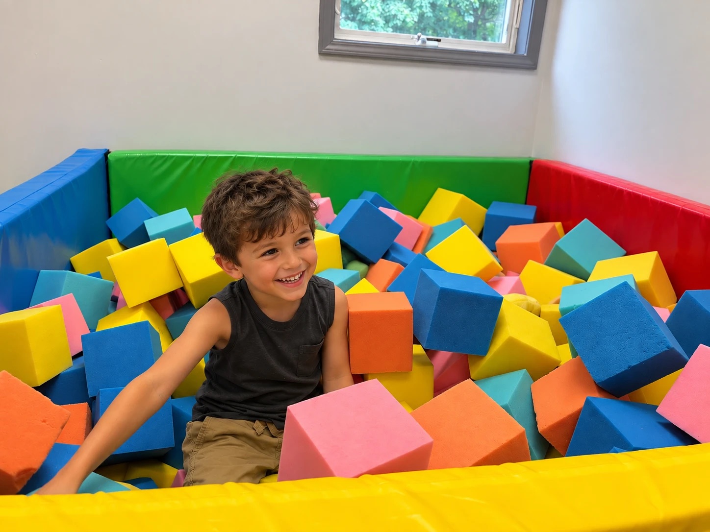 Boy smiling in the foam pit